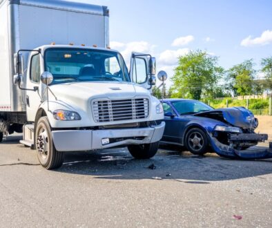 Collision of a truck with a passenger car on the highway road, as a result of which both were damaged in Tulsa, OK