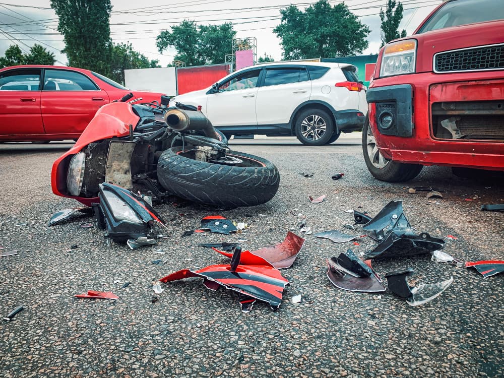 Motorcycle Accident Scene with Vehicle Damage