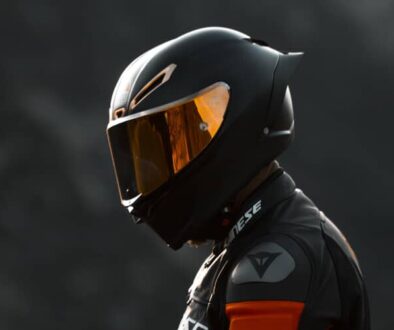 Close-up of motorcyclist wearing a full-face helmet and safety gear