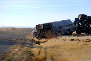 Overturned truck on rural road shoulder