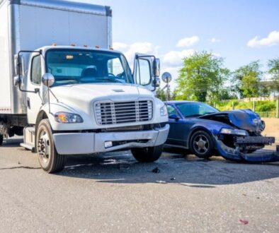 Semi-truck and car crash on highway