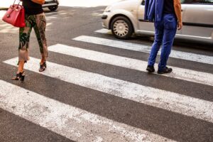 Pedestrians using a crosswalk near moving traffic in an Tulsa